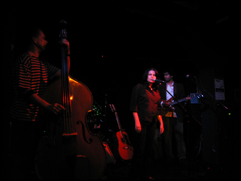 Letterbox band performing with double bass, singer and guitarist